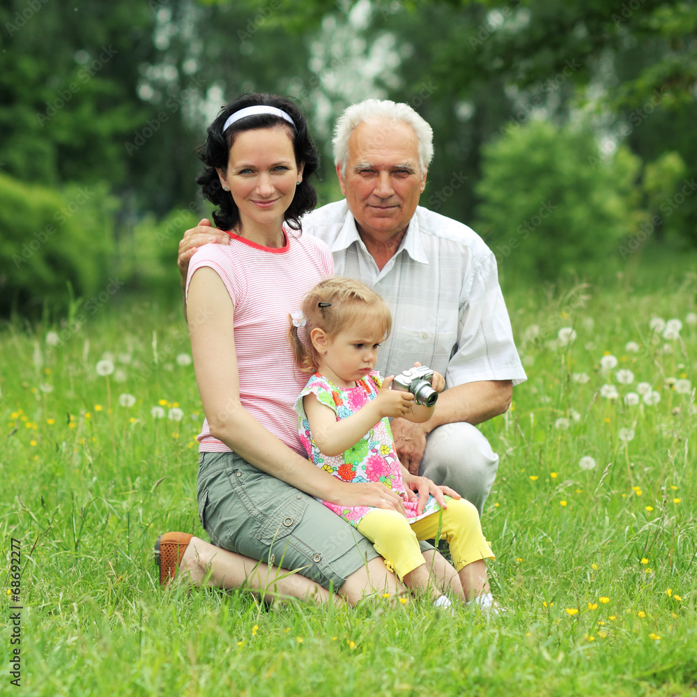 Grandfather, daughter and granddaughter are photographed Grandfather, daughter and granddaughter are photographed