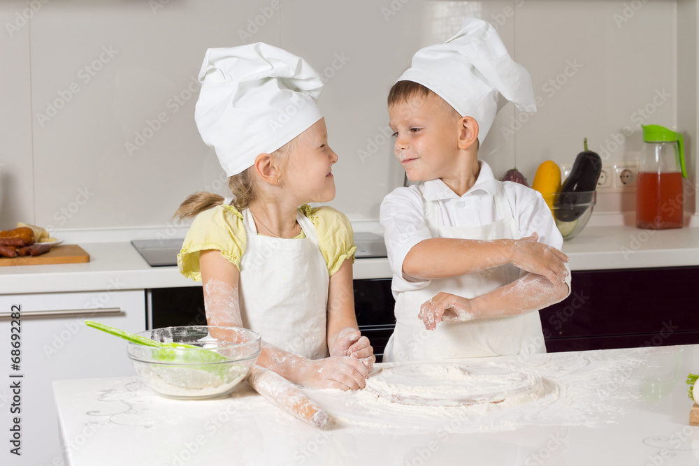 Adorable Little Chefs Playing at Kitchen Adorable Little Chefs Playing at Kitchen