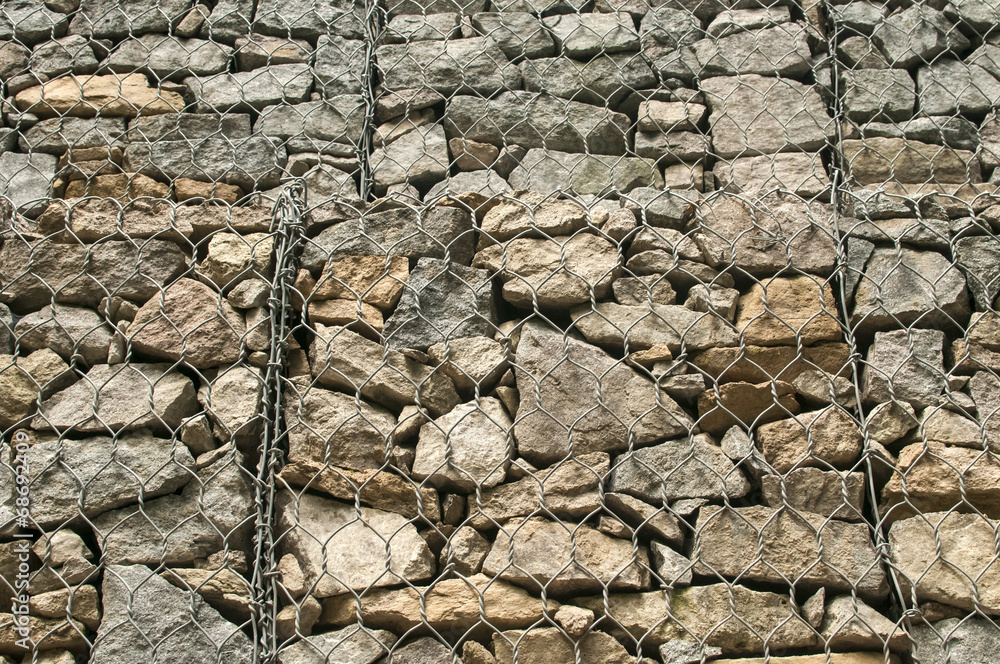 Fototapeta premium Gabion plastic covered wire mesh baskets filled with stone