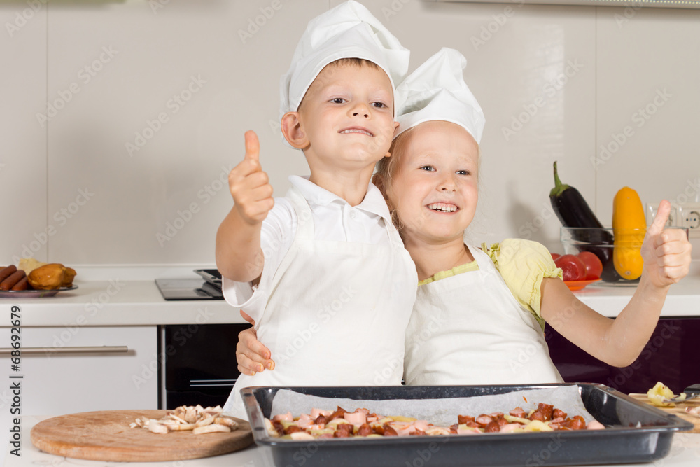 Two Little Chefs Showing Thumbs Up Two Little Chefs Showing Thumbs Up