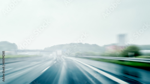 Driving on a Freeway on a Rainy and Misty Day © trendobjects