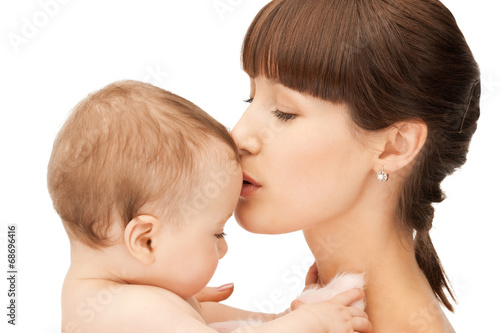 happy mother kissing baby