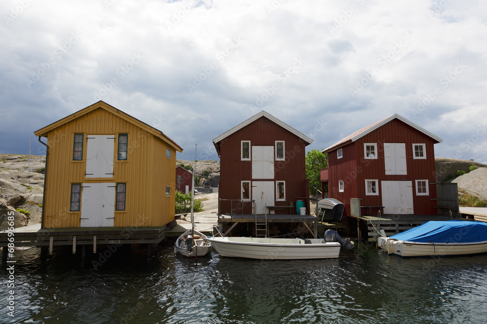 Boathouses at famous Smögen bridge in Bohuslän, Sweden.