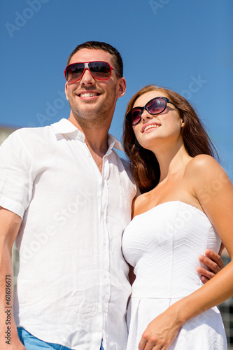 smiling couple in city