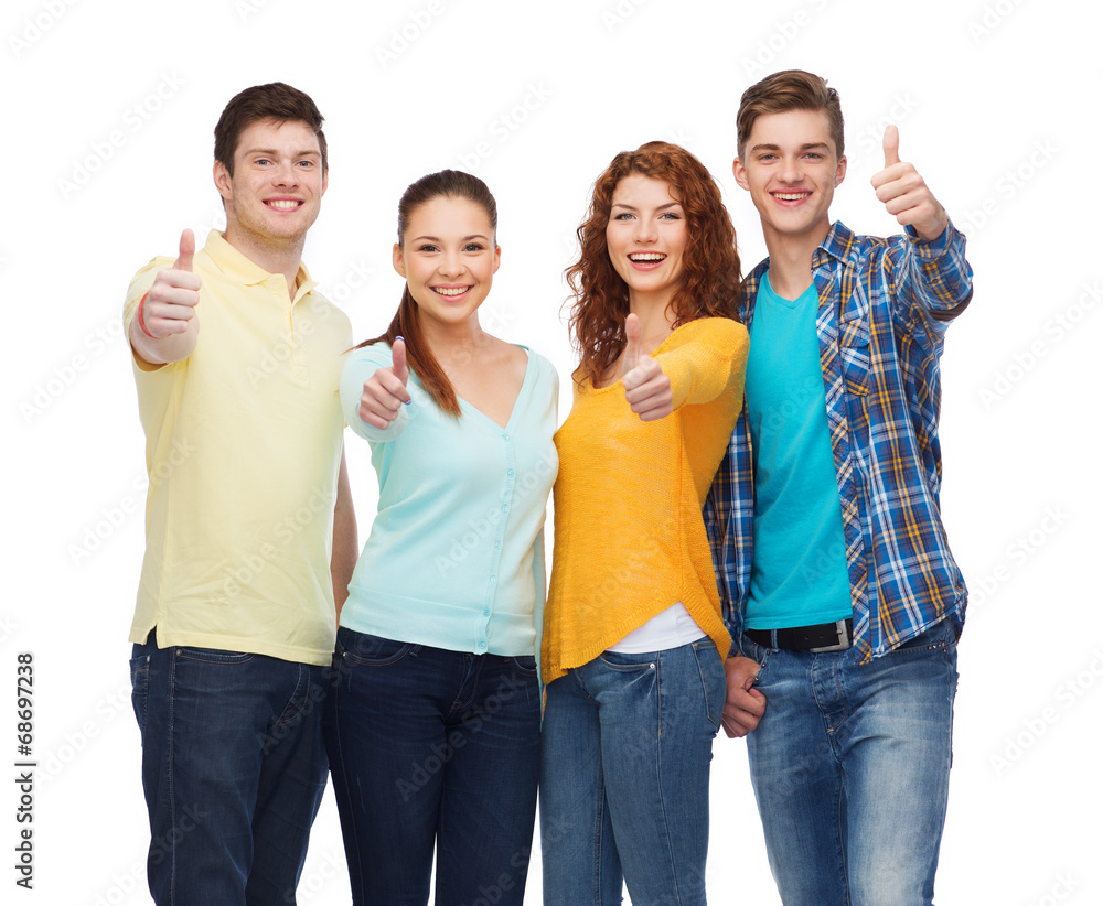 group of smiling teenagers showing thumbs up group of smiling teenagers showing thumbs up