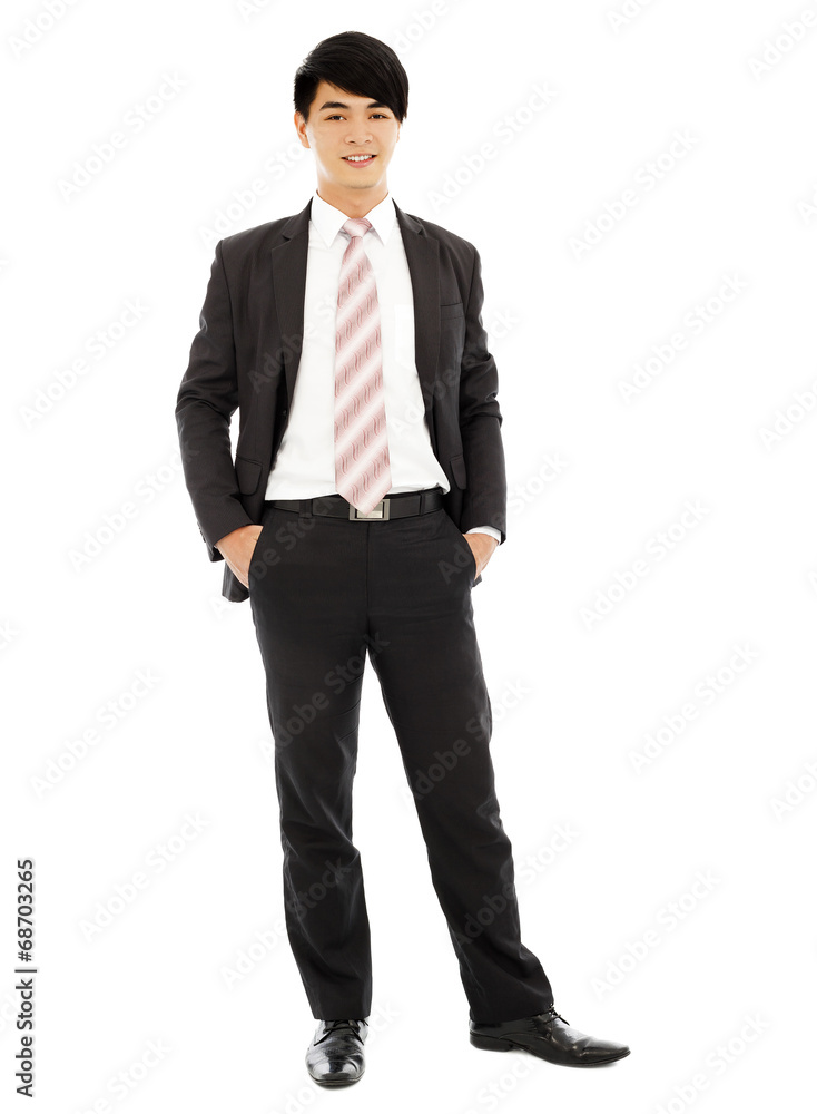 young businessman standing and hands on pocket young businessman standing and hands on pocket