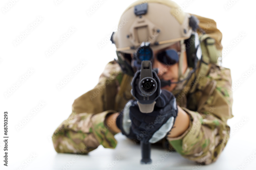 Soldier with rifle against and lying on floor.isolated on white Soldier with rifle against and lying on floor.isolated on white