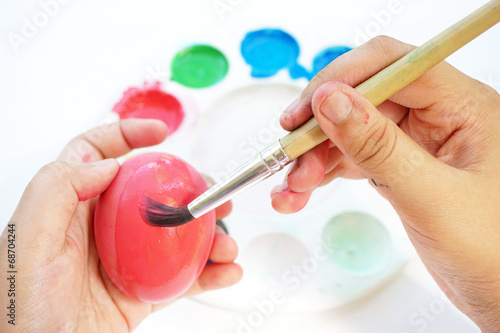 Children s hand painting Easter eggs