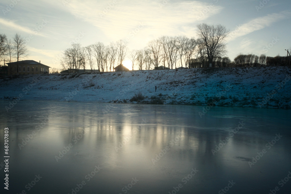 frozen river shore small town