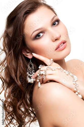 Beautiful young woman in necklace