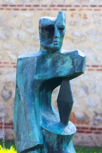 modern abstract bronze sculpture of a person