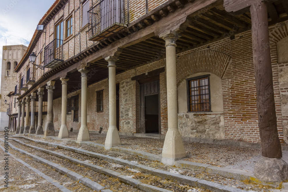 Typical stone columns supporting wooden and brick houses in Arev