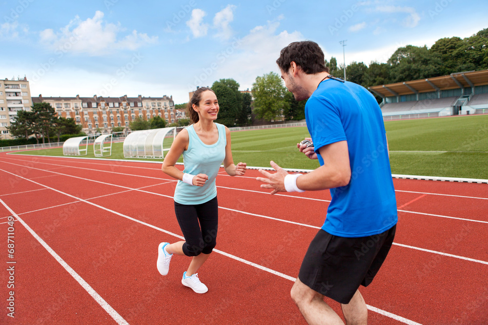 Obraz premium Sport coach training a young attractive woman