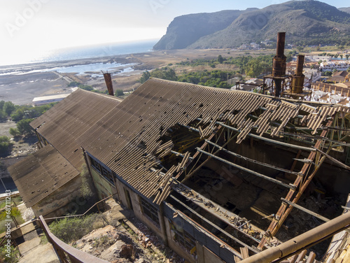 broken and destroyed roof of an old abandoned industry