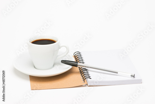 Cup of coffee with notebook