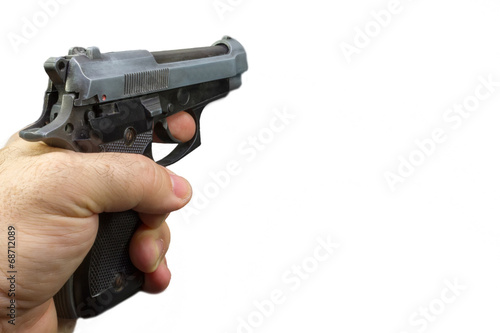 semiautomatic pistol in a hand with white background