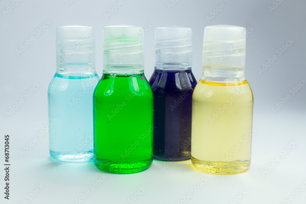 boats containers with liquids of colors Blue green purple yellow boats containers with liquids of colors Blue green purple yellow