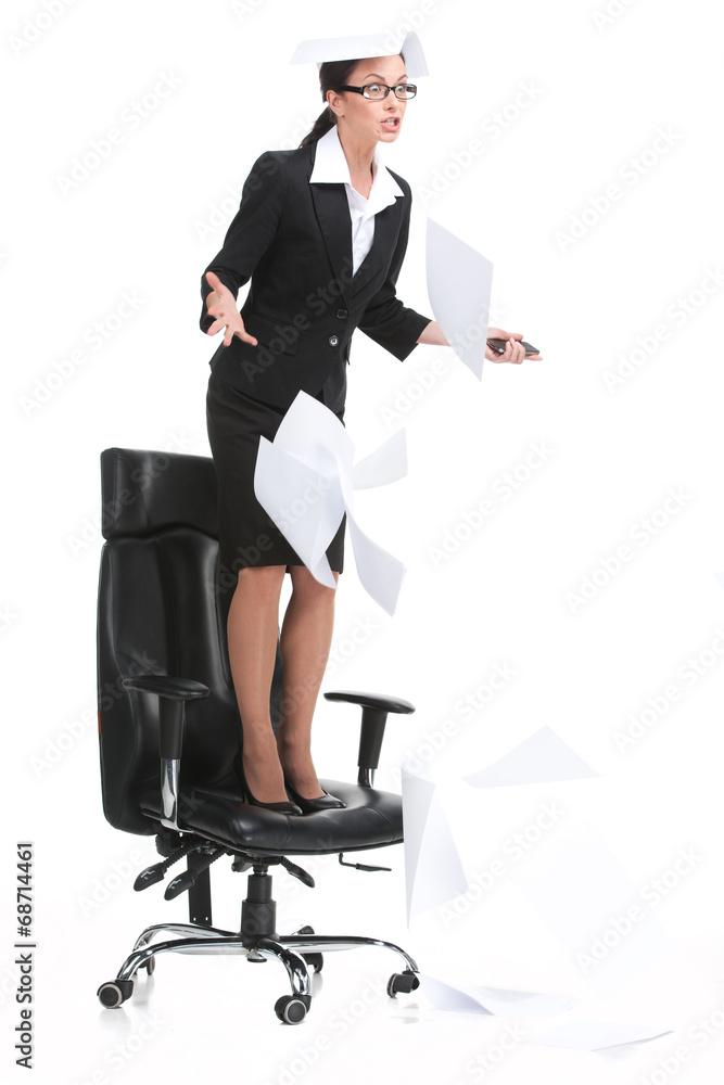 angry businesswoman shouting when standing on chair. angry businesswoman shouting when standing on chair.