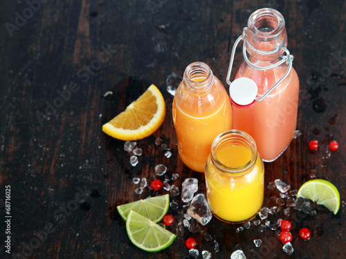 Preparing tasty healthy summer fruit juices photo