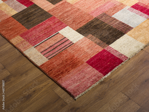 Rug carpet on wooden floor close up