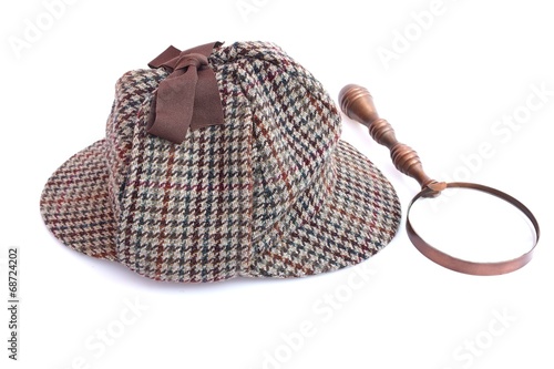 Deerhunter or Sherlock Holmes cap and vintage magnifying glass