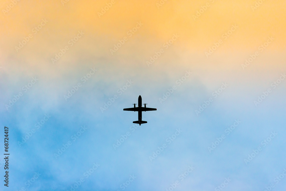 Silhouette of an airplane in sunset Silhouette of an airplane in sunset