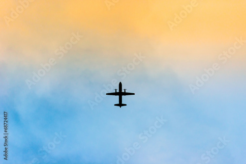 Silhouette of an airplane in sunset