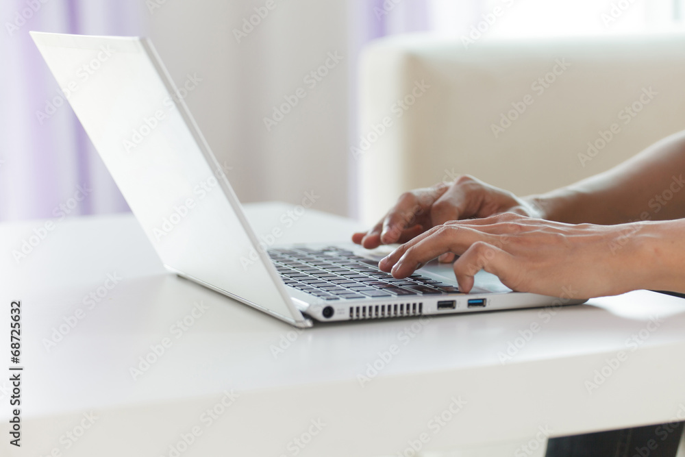hands typing on laptop keyboard hands typing on laptop keyboard
