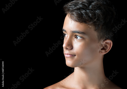 Smiling handsome hispanic teenage boy
