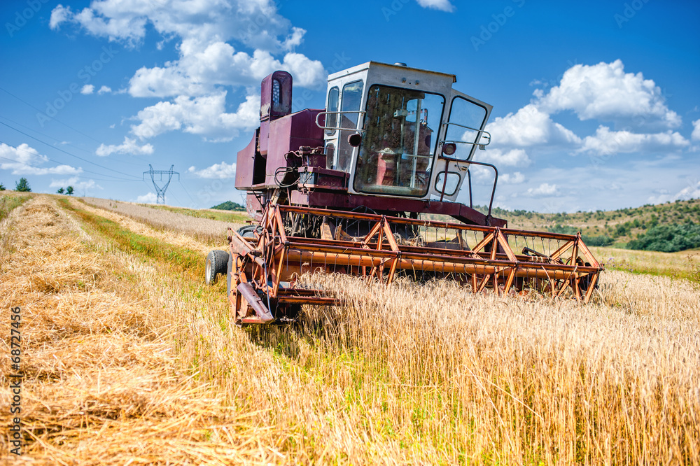 Fototapeta premium old combine corn and wheat harvester. Agriculture industry