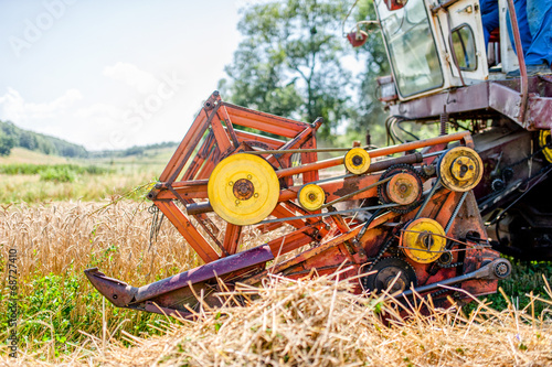 agricultural activities with combine harvesting machine in wheat