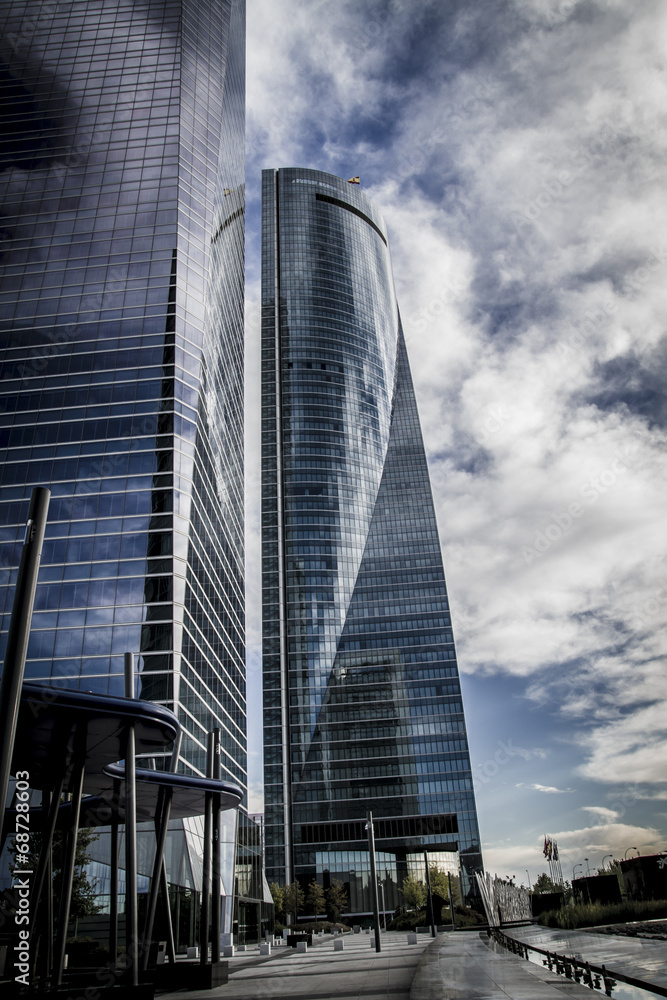 modern, skyscraper with glass facade and clouds reflected in win