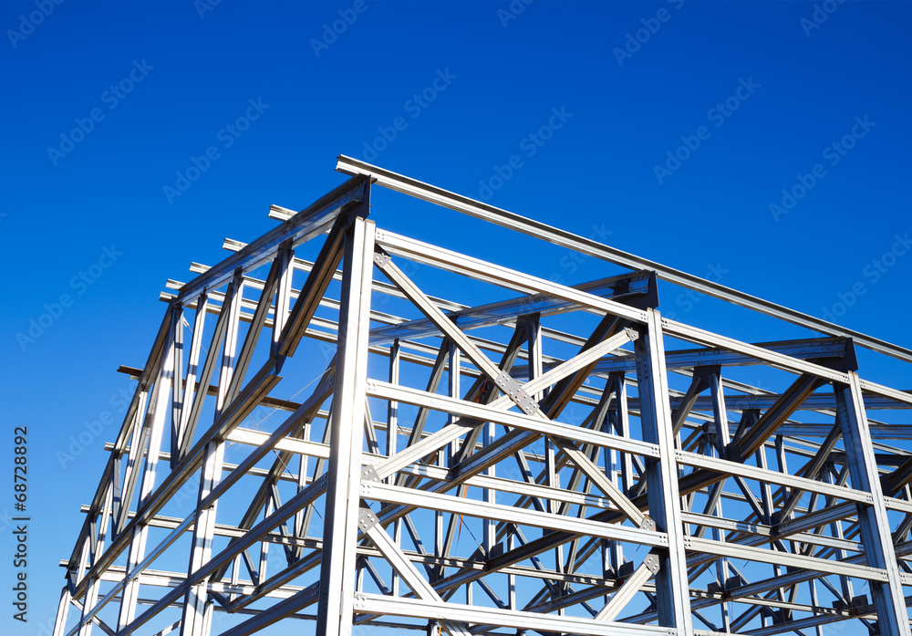 metal frame of the roof against the blue sky - obrazy, fototapety, plakaty 