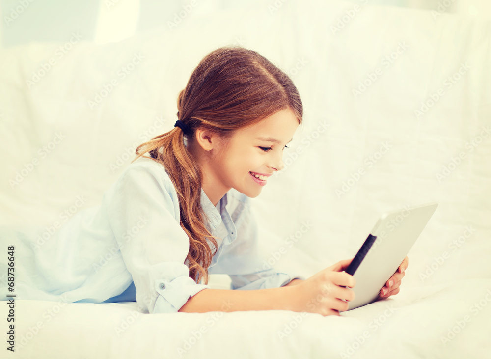 smiling girl with tablet computer at home smiling girl with tablet computer at home