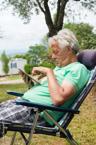 Senior man with digital tablet