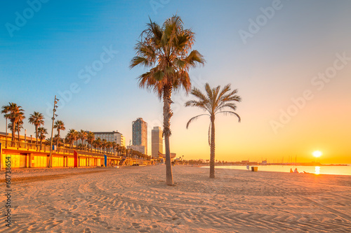 Barceloneta Beach in Barcelona at sunrise photo
