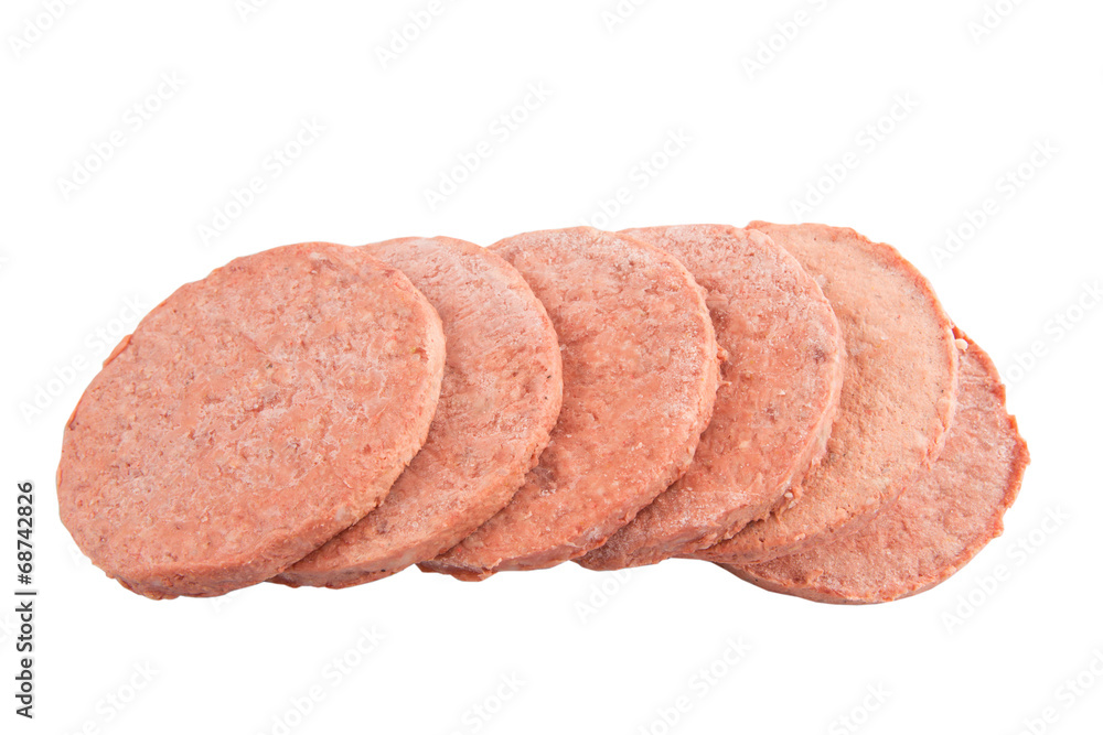 Frozen raw hamburger beef meat over white background Frozen raw hamburger beef meat over white background