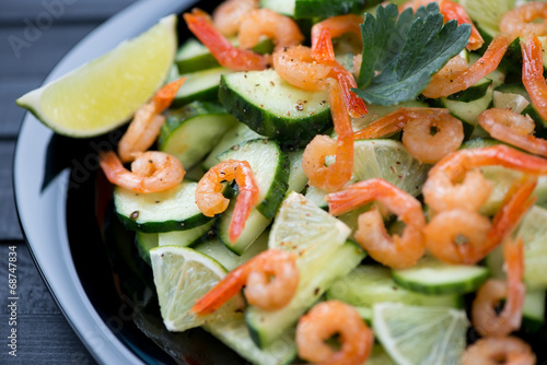 Close-up of shrimps, cucumber and lime salad