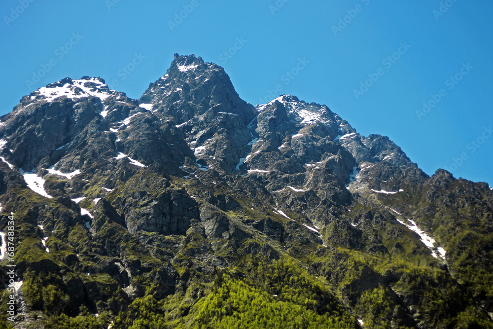 Fototapeta premium Caucasus mountains under snow and clear blue sky