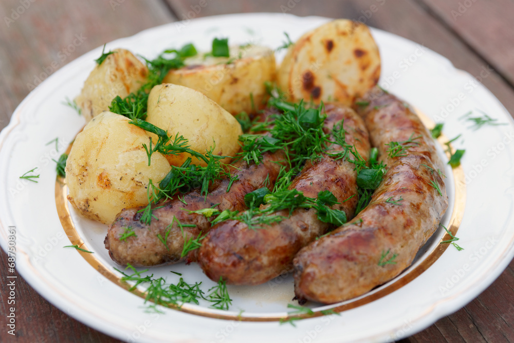 Grilled sausages and potatoes Grilled sausages and potatoes