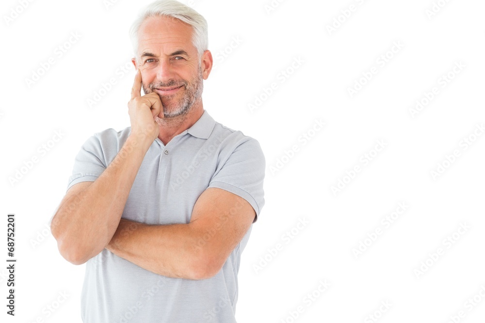 Smiling man posing with arms crossed Smiling man posing with arms crossed