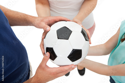 Family Holding Soccer Ball