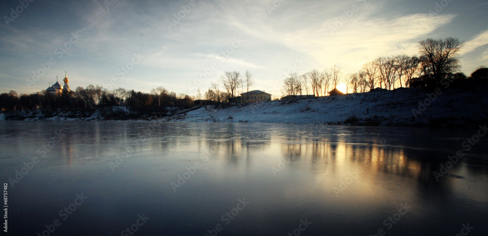 frozen river shore small town