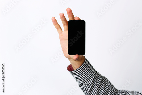 Closeup portrait of a male hand holding smartphone