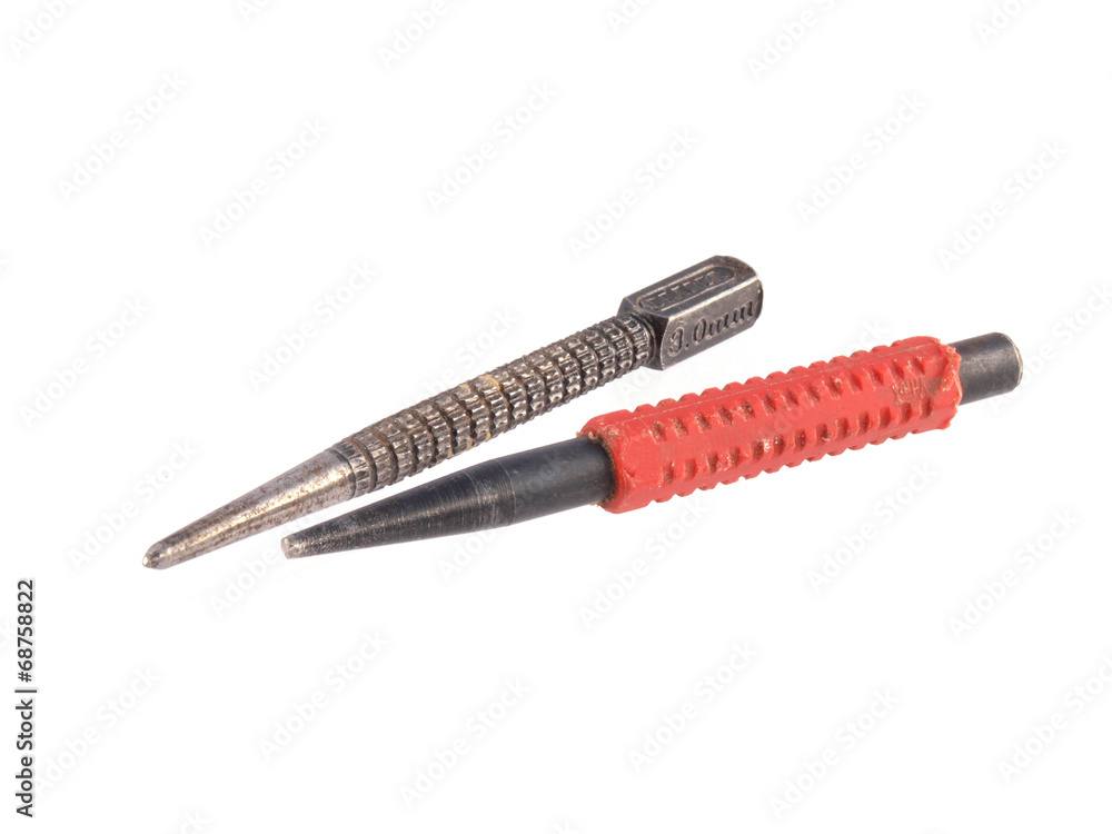 Close up photo of two nail punches on a white background. Close up photo of two nail punches on a white background.