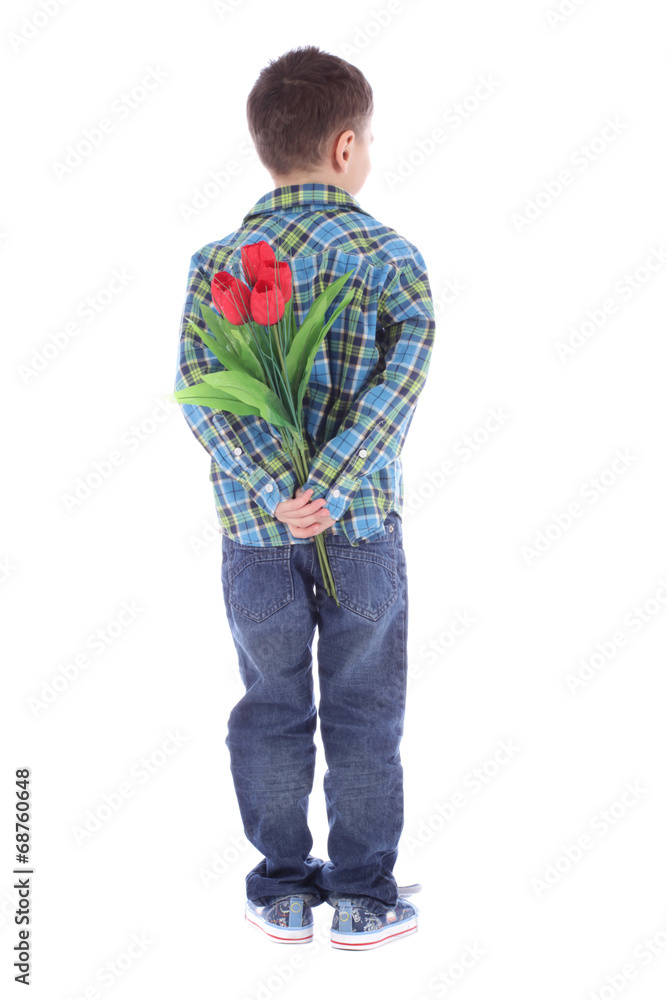 boy hiding flowers of red tulips behind itself, isolated on whit boy hiding flowers of red tulips behind itself, isolated on whit