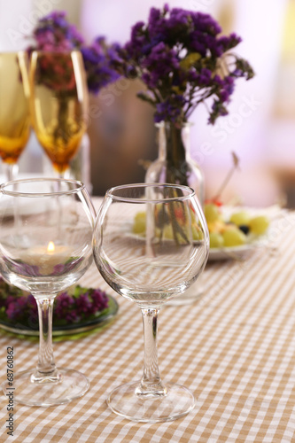 Buffet table with dishware waiting for guests