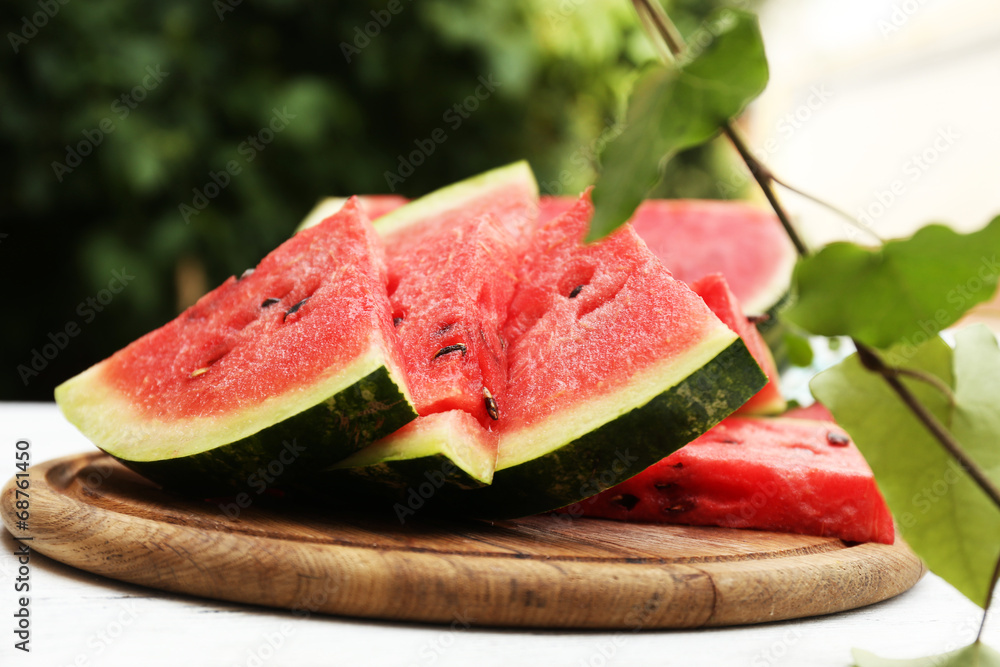 Fresh slices of watermelon on table, outdoors Fresh slices of watermelon on table, outdoors