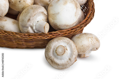 basket of mushrooms on white background