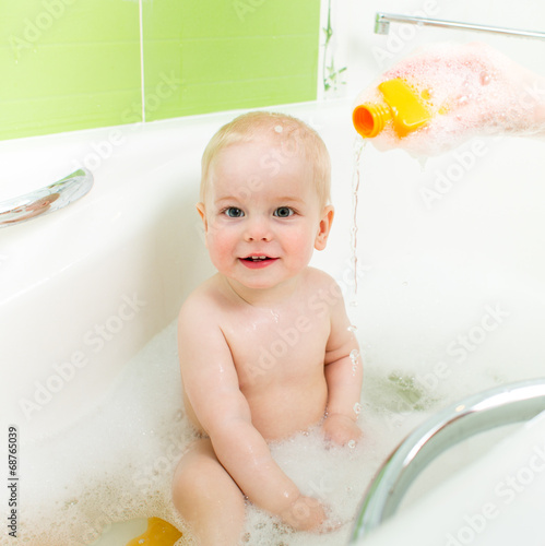 mom washing baby boy
